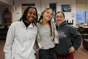  students smiling together in the library